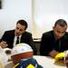 Michigan junior Jordan Morgan and sophomore Jon Horford sign merchandise on Tuesday, April 16. AnnArbor.com I Daniel Brenner